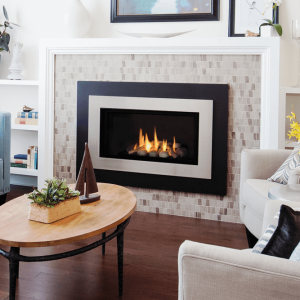 Valor H4 Gas Fireplace with decorative rocks and fluted balck liner